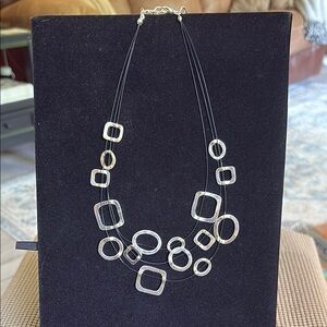 Silver Pendant Necklace with Intricate Detailing